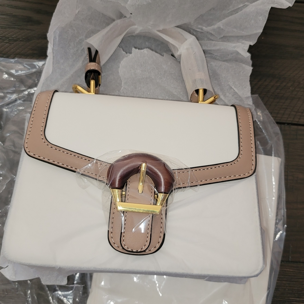 New leather purse w gold and leather buckle and storage bag approx 5x8